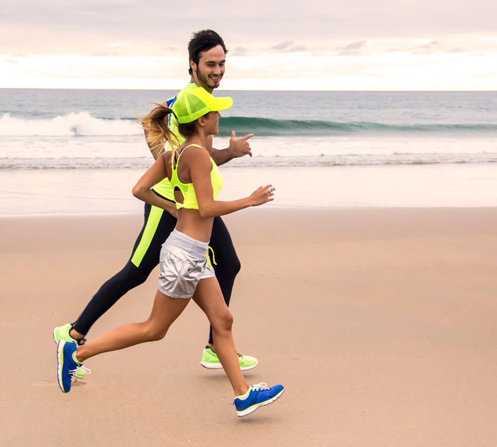 Couple running on a beach
